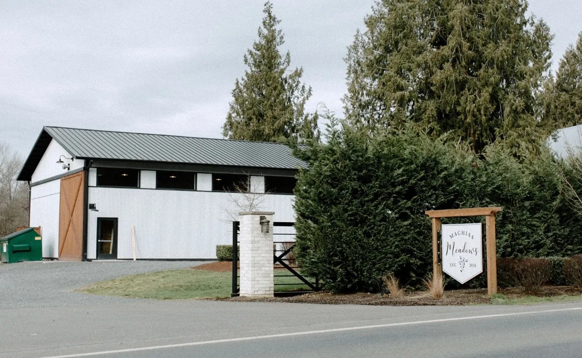 Exterior of the Machias Meadows event venue with its entrance sign